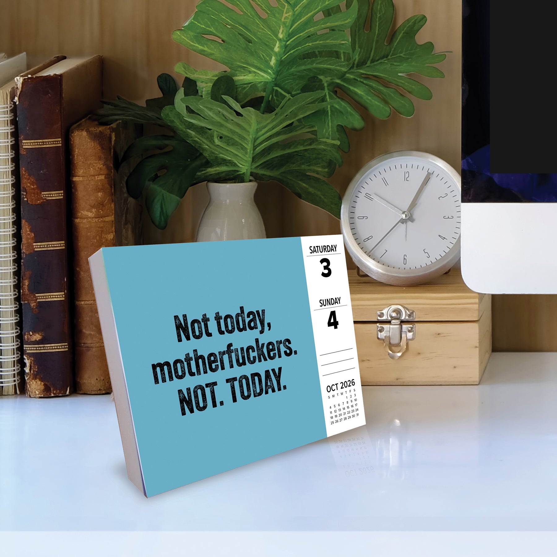 No F*cks Given 2026 Daily Box Calendar on desk with the quote 'Not today, motherfuckers. NOT. TODAY.'