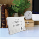 2026 Daily Box Calendar featuring the word 'Bluffquake' with a definition on a desk.